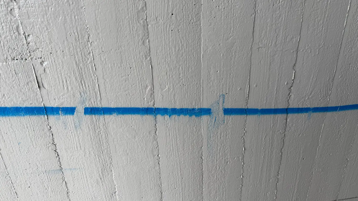 Blue graffiti trace on a treated concrete surface in the Rostock reference project