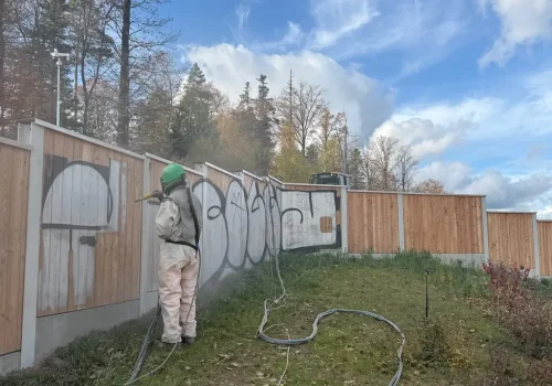 Graffiti Removal on Larch Wood - Before Image and Removal Process