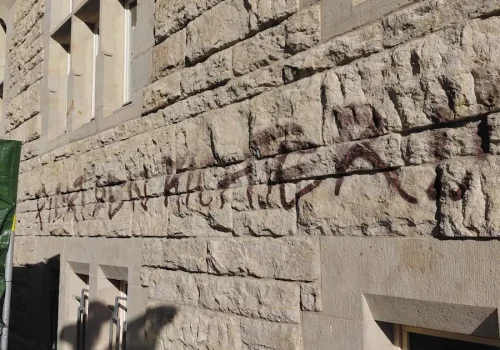 Chemical-Free Graffiti Removal on a Natural Stone Facade of Rudolstadt District Court - Before Image